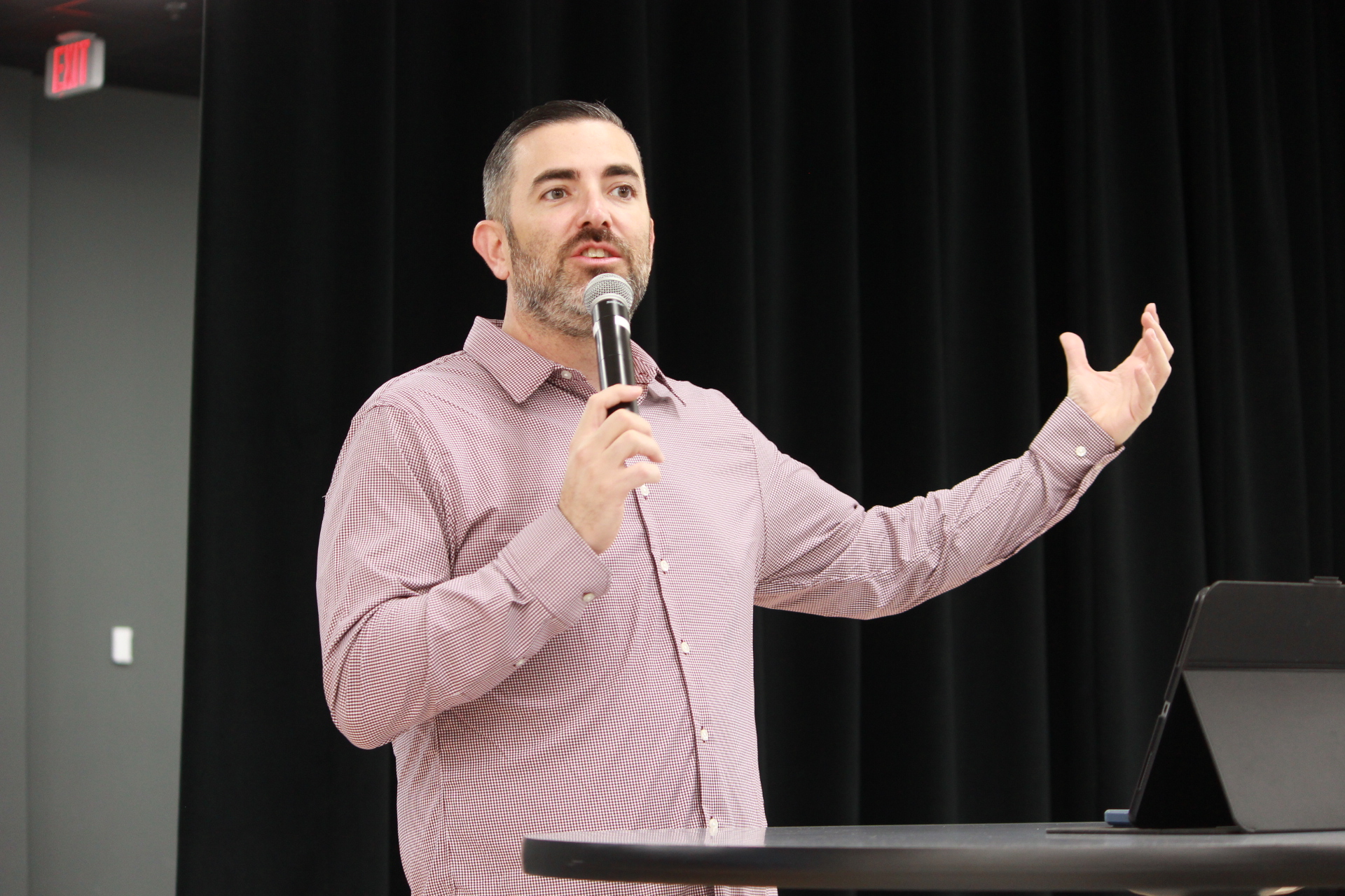 Pastor Chris preaching on Sunday